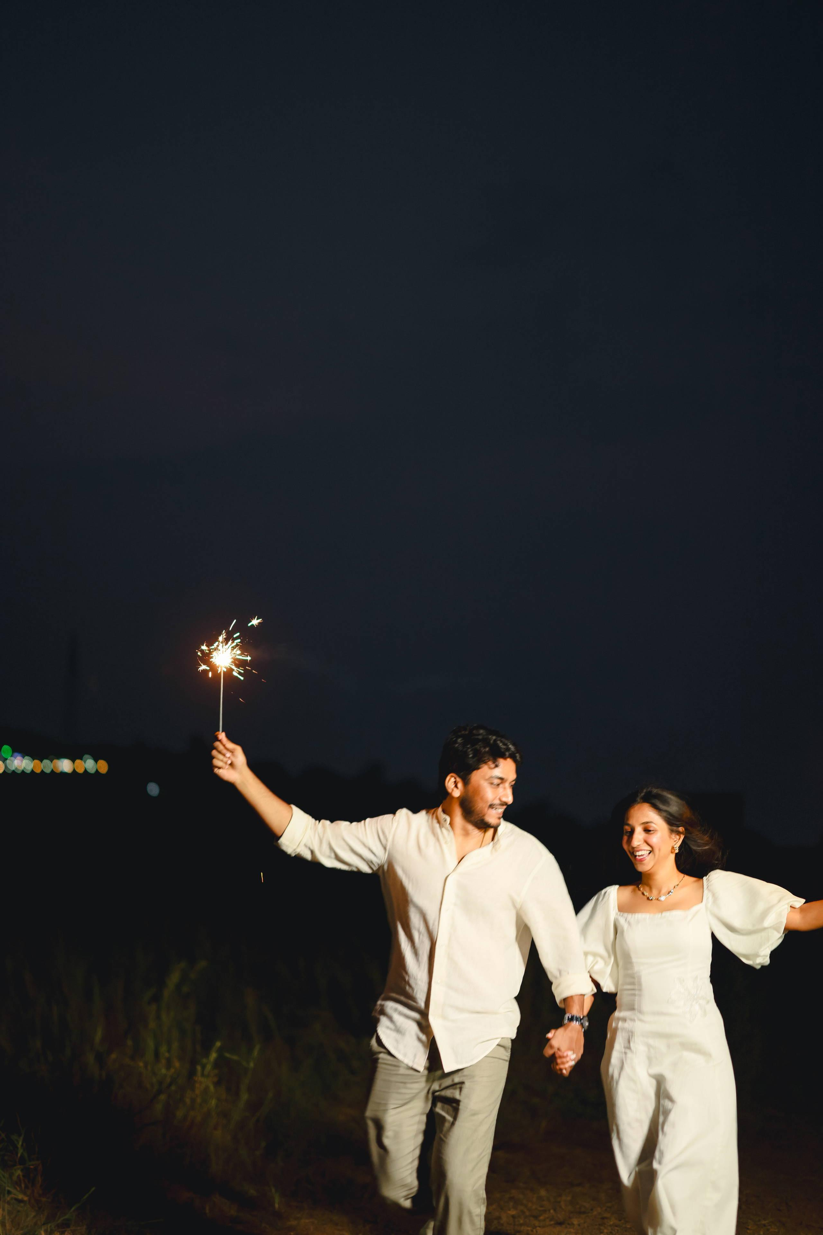 Celebrating with sparklers at night